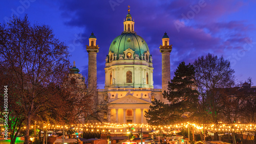 Festive cityscape - view of the Christmas Market on Karlsplatz (Charles' Square) and the Karlskirche (St. Charles Church) in the city of Vienna, Austria photo