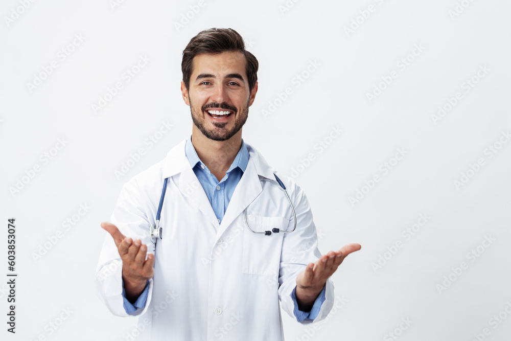 man doctor in a white coat with a stethoscope and wearing glasses for a smile hands up victory and happiness on a white isolated background looking into the camera, copy space, space for text, health man doctor in a white coat with a stethoscope and wearing glasses for a smile hands up victory and happiness on a white isolated background looking into the camera, copy space, space for text, health