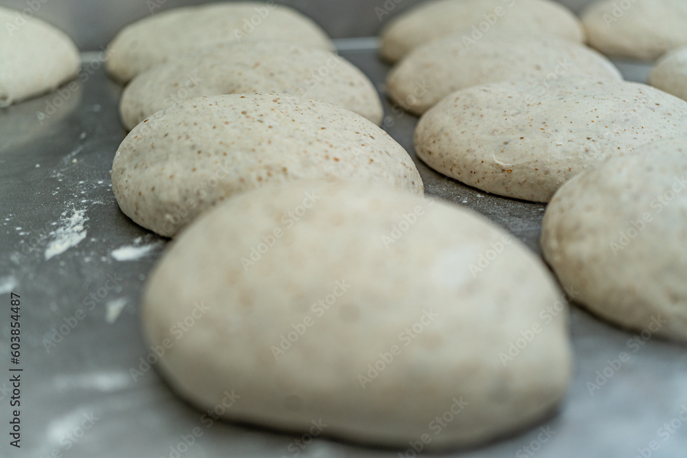 Fresh bread dough on a metal table Fresh bread dough on a metal table