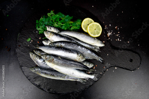 Whole Sardines on black slate