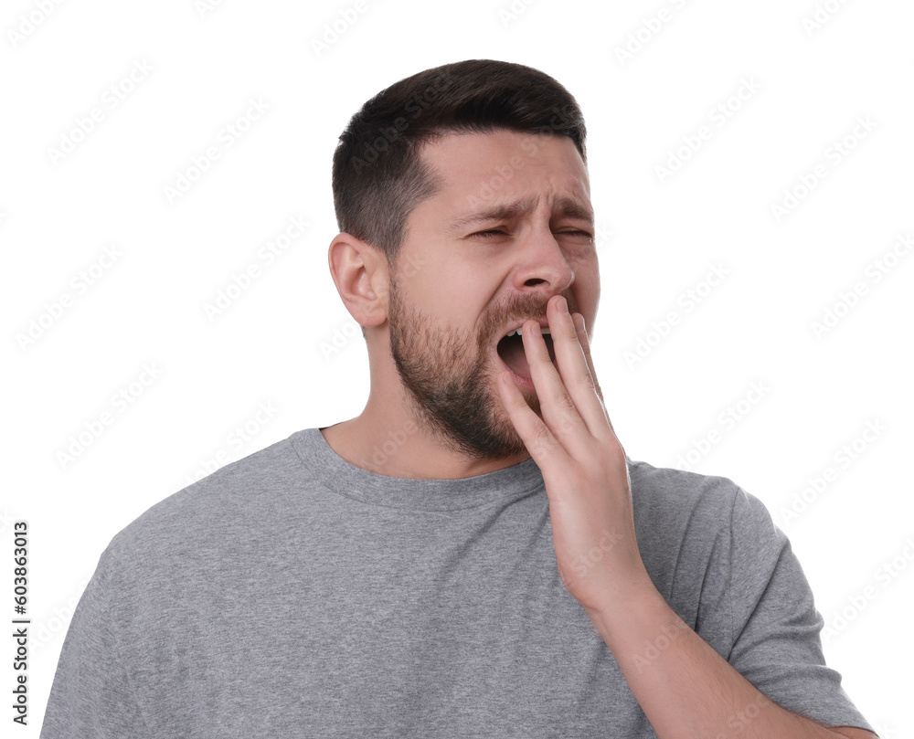 Sleepy man yawning on white background. Insomnia problem