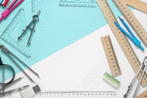 Flat lay composition with different rulers and compasses on color background. Space for text