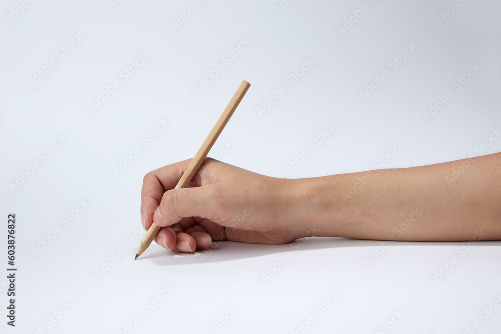 Hand holding a pencil isolated on white background Hand holding a pencil isolated on white background