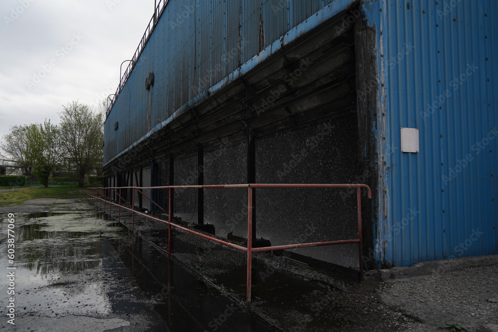 Almaty, Kazakhstan - 04.17.2023 : Cooling towers with water at the old heating plant. Almaty, Kazakhstan - 04.17.2023 : Cooling towers with water at the old heating plant.