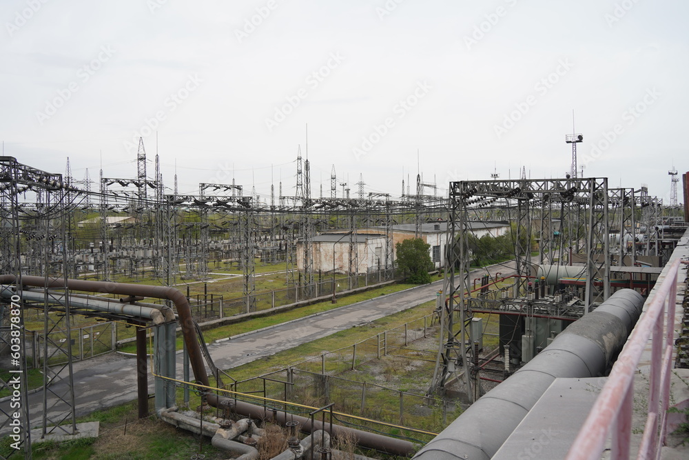Almaty, Kazakhstan - 04.17.2023 : Power lines with inductors and stabilizers at the heating plant. Almaty, Kazakhstan - 04.17.2023 : Power lines with inductors and stabilizers at the heating plant.
