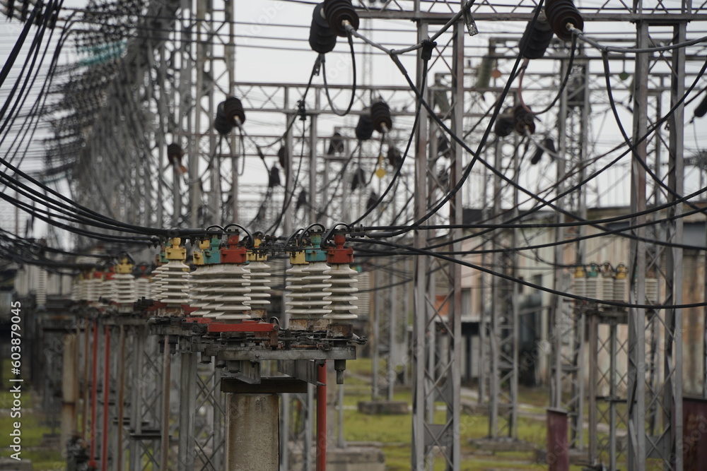 Almaty, Kazakhstan - 04.17.2023 : Power lines with inductors and stabilizers at the heating plant.
