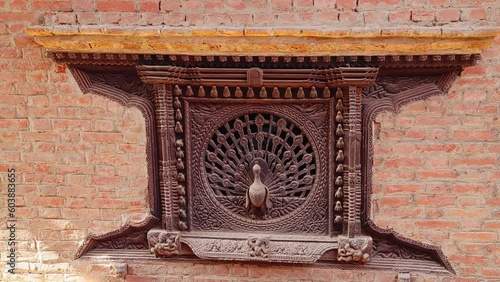 Moving towards the wood carved Peacock Window off of Dattatraya Square, Bhaktapur, Kathmandu Valley, Nepal photo