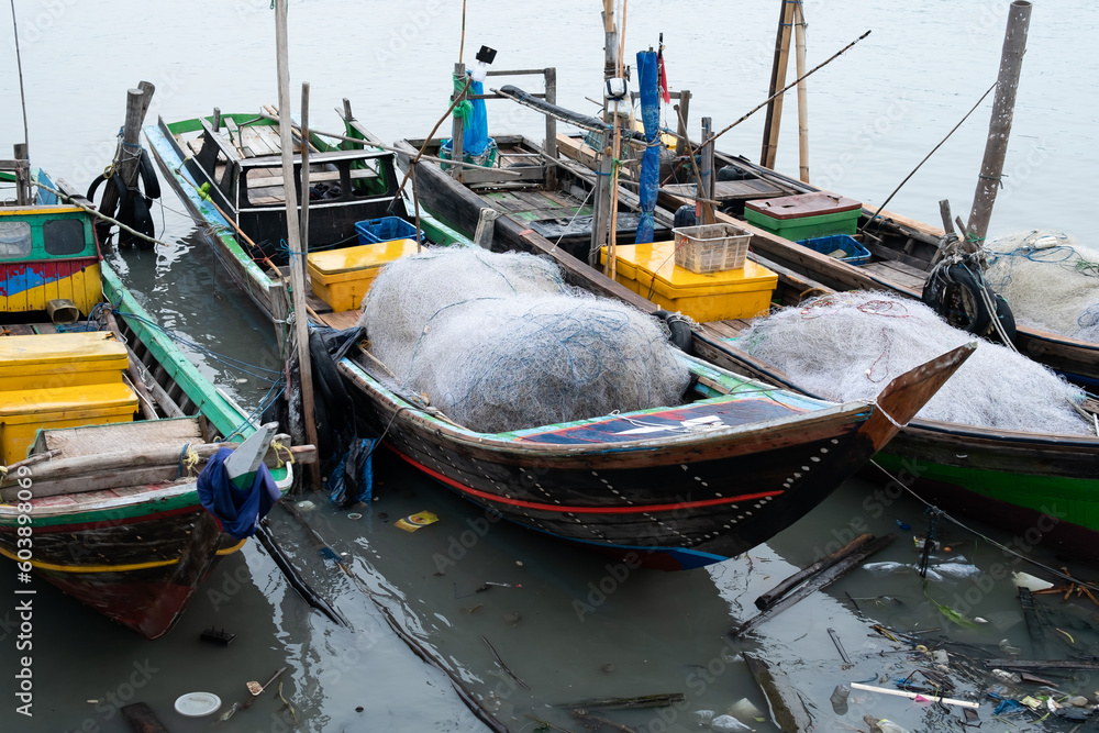Rows of fishing net boats parked at a fish auction in Indonesia Rows of fishing net boats parked at a fish auction in Indonesia