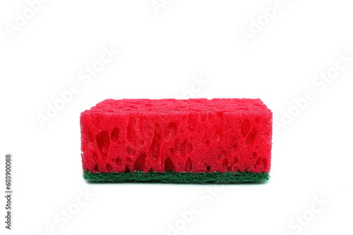 A red soft sponge for washing dishes lies on a white background. 