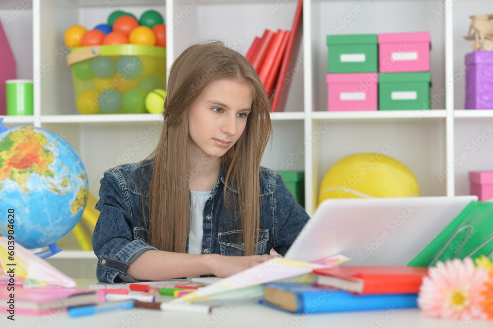 girl with laptop at home at desk girl with laptop at home at desk