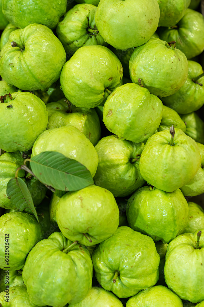 Food Background. Delicious fruits for sale in the market. Closeup fresh guavas. A lots of guava. Food Background. Delicious fruits for sale in the market. Closeup fresh guavas. A lots of guava.