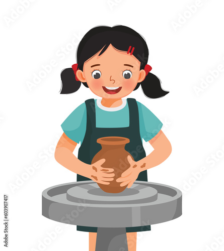 Cute little girl making ceramic pot on pottery wheel in a workshop 