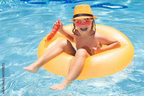 Summer child face. Child in swimming pool. Summer kids activity. Summer vacation. Healthy kids lifestyle.