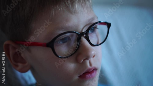 Health care, clear vision concept. Close up portrait of pensive schoolboy in glasses