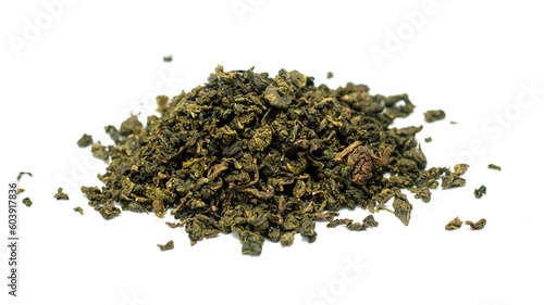 dry green tea leaves on white