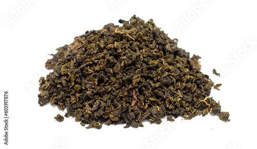 dry green tea leaves on white