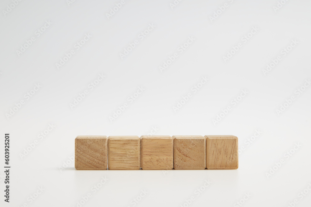 Fototapeta premium Wooden cube blocks with empty copy space for message word