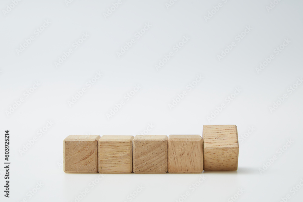Fototapeta premium Wooden cube blocks with empty copy space for message word