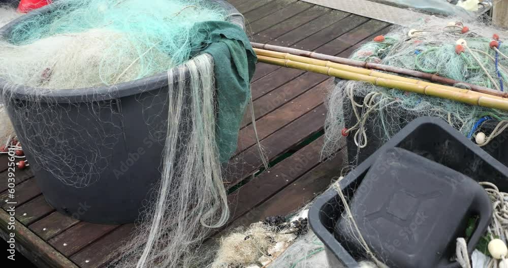 Fishing rods and fishing nets on the pier in the port of Piran, Slovenia. Fishing rods and fishing nets on the pier in the port of Piran, Slovenia.