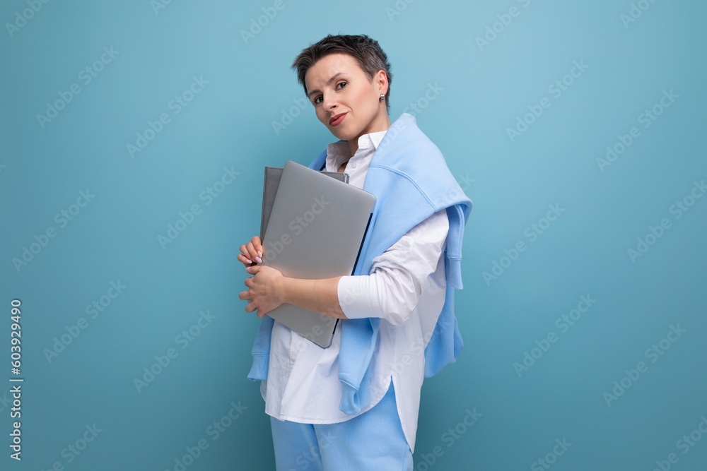 remote professions business concept. young woman holding a laptop in her hands remote professions business concept. young woman holding a laptop in her hands