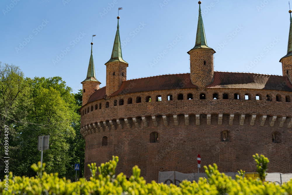 Fototapeta premium Kraków Barbican on Basztowa Street in Krakow, Poland. Barbakan Krakowski monument. Historic fortified gateway of the Old Town of Cracow.