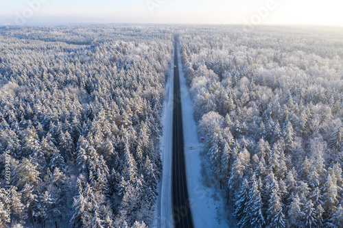 Wallpaper Mural Beautiful winter drone aerial landscape photo - snowy frozen trees and straight road on sunset time, Poland, Suwalszczyzna Torontodigital.ca