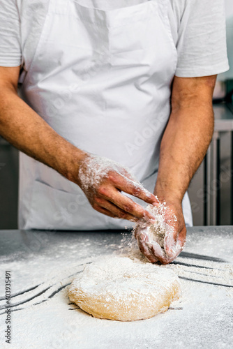 Artisan Baker Kneading Fresh Dough in Flour, Close-up Shot