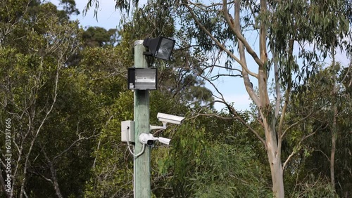 Outdoor CCTV Surveillance with Light Pole in Urban Environment photo