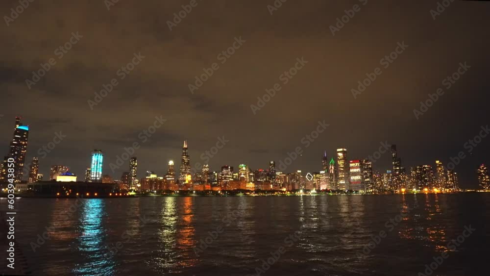 Skyscrapers in chicago at night with lake michigan Skyscrapers in chicago at night with lake michigan