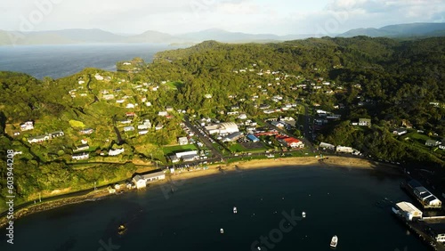 Oban township lit by warm morning sunrise, aerial view photo