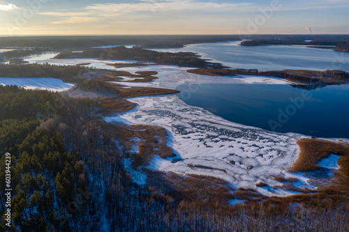 Wallpaper Mural Beautiful winter landscape - drone aerial photo sunset time - frozen Wigry lake, forest and sun reflections in water and ice Torontodigital.ca