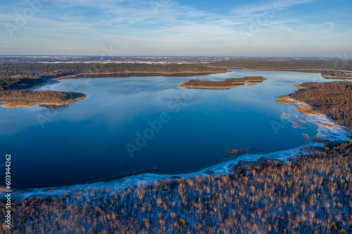 Wallpaper Mural Beautiful winter landscape - drone aerial photo sunset time - frozen Wigry lake, forest and sun reflections in water and ice Torontodigital.ca