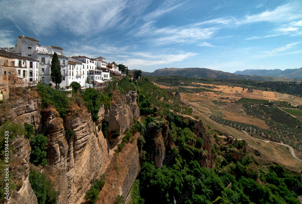 Ronda, Andalusia, Spain, Europe - Famous white houses on high cliffs above picturesque Canyon El Tajo de Ronda