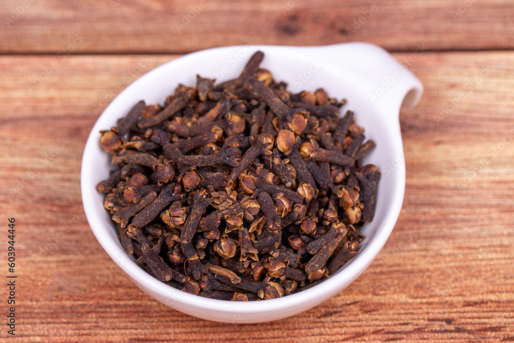 Clove. Dried Clove on wooden background. Spice concept. Close up Clove. Dried Clove on wooden background. Spice concept. Close up