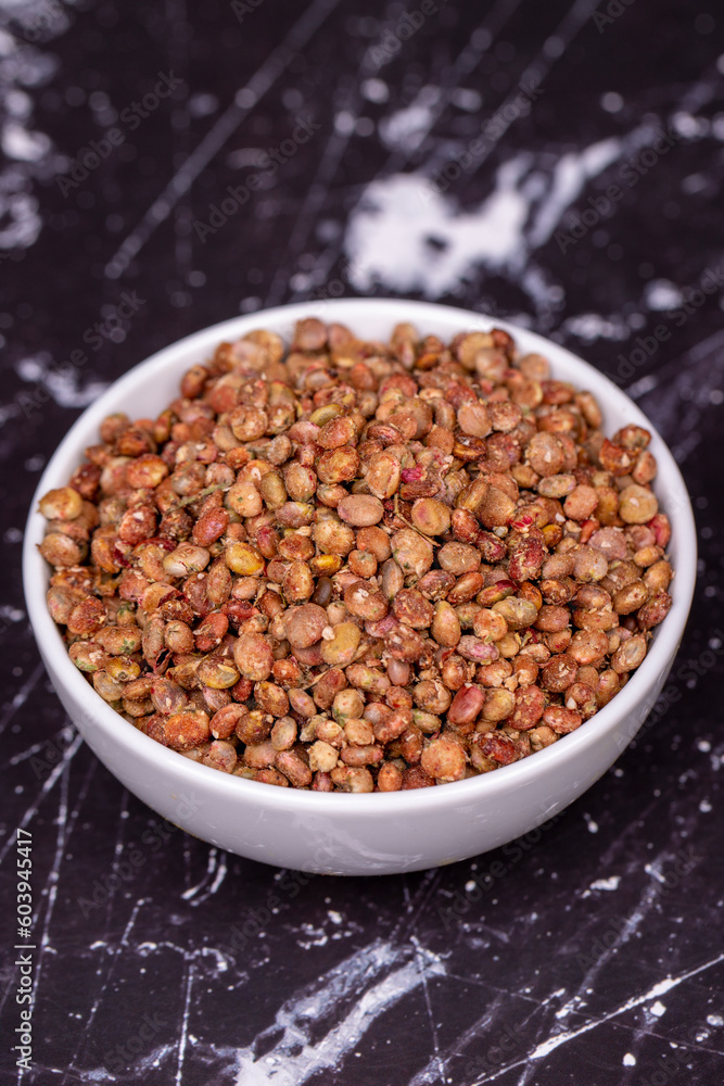 Sumac seeds. Dried sumac berries on dark background. Spice concept Sumac seeds. Dried sumac berries on dark background. Spice concept