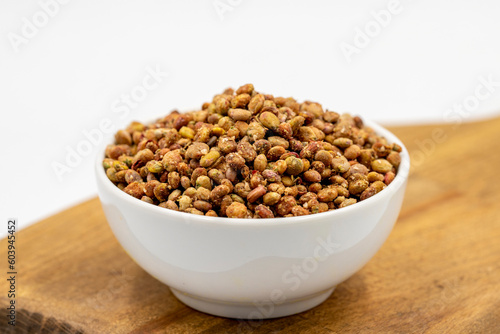 Sumac seeds. Dried sumac berries isolated on white background. Spice concept
