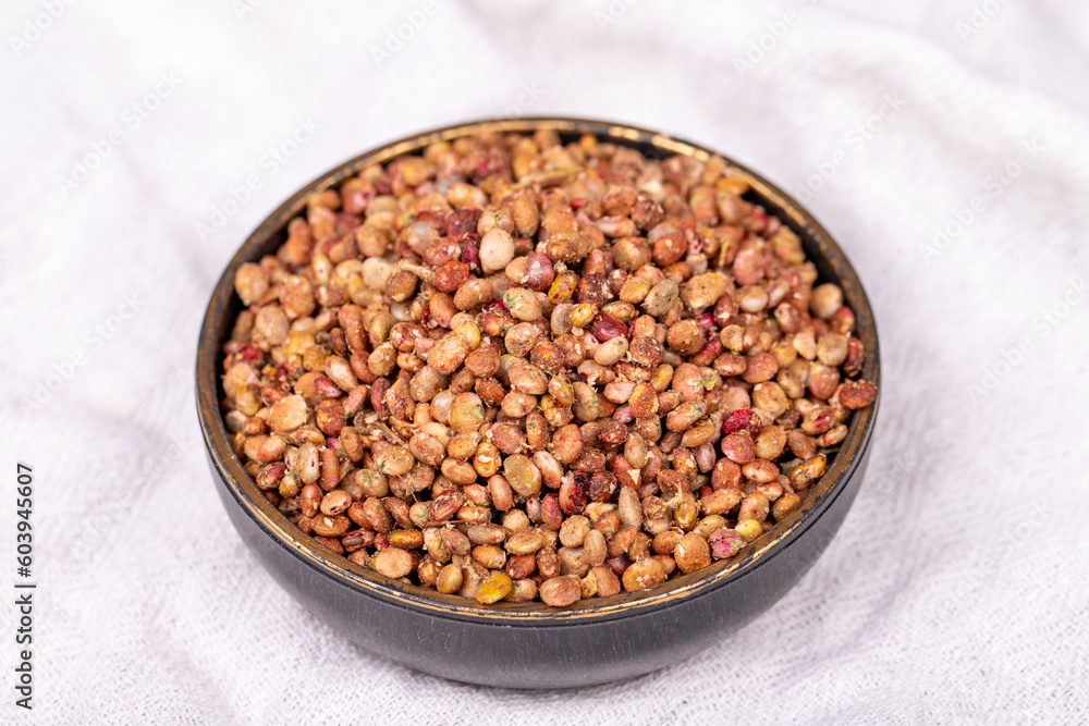 Sumac seeds. Dried sumac berries on white background. Spice concept. Close up Sumac seeds. Dried sumac berries on white background. Spice concept. Close up