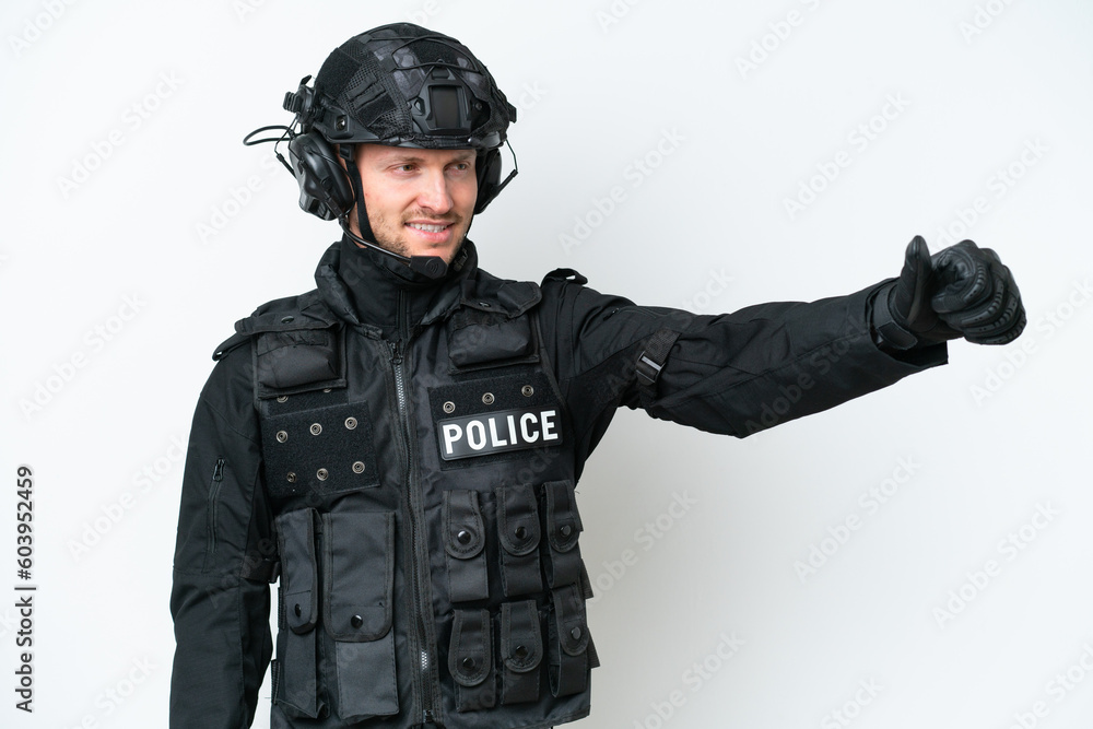 SWAT man over isolated white background giving a thumbs up gesture SWAT man over isolated white background giving a thumbs up gesture