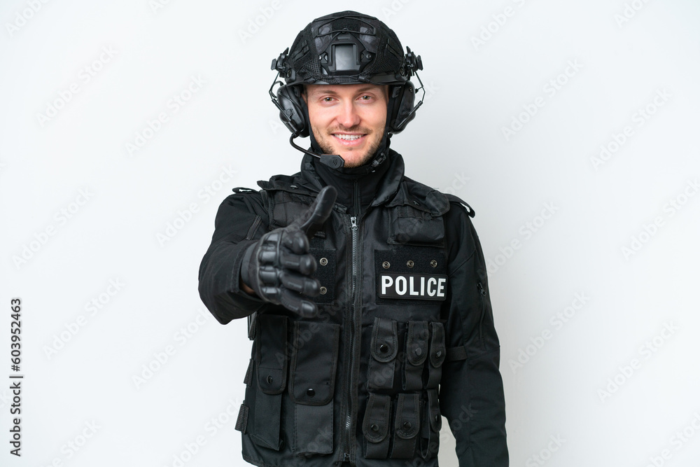 SWAT man over isolated white background shaking hands for closing a good deal SWAT man over isolated white background shaking hands for closing a good deal