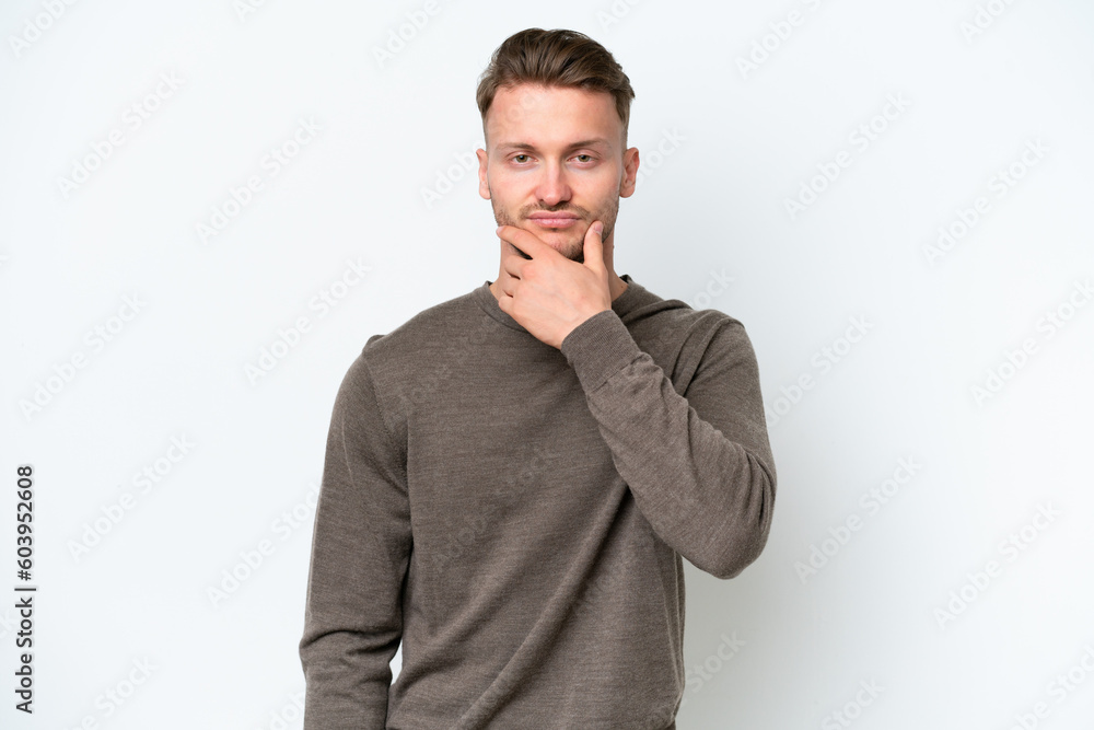 Young blonde caucasian man isolated on white background thinking Young blonde caucasian man isolated on white background thinking