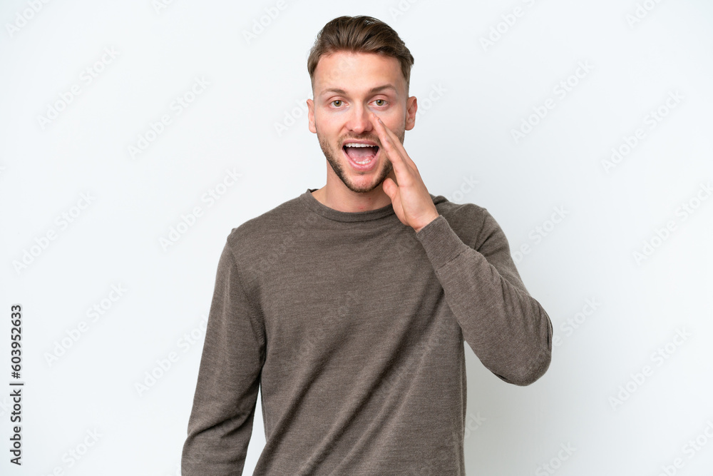 Young blonde caucasian man isolated on white background with surprise and shocked facial expression Young blonde caucasian man isolated on white background with surprise and shocked facial expression