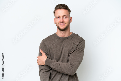 Young blonde caucasian man isolated on white background laughing © luismolinero