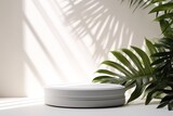 Smooth round white podium in sunlight, tropical palm leaf shadow for on white table countertop, product background