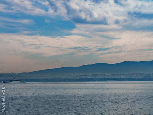 View of the sea and mountains in the distance from the ferry. Beautiful landscape. Copy space