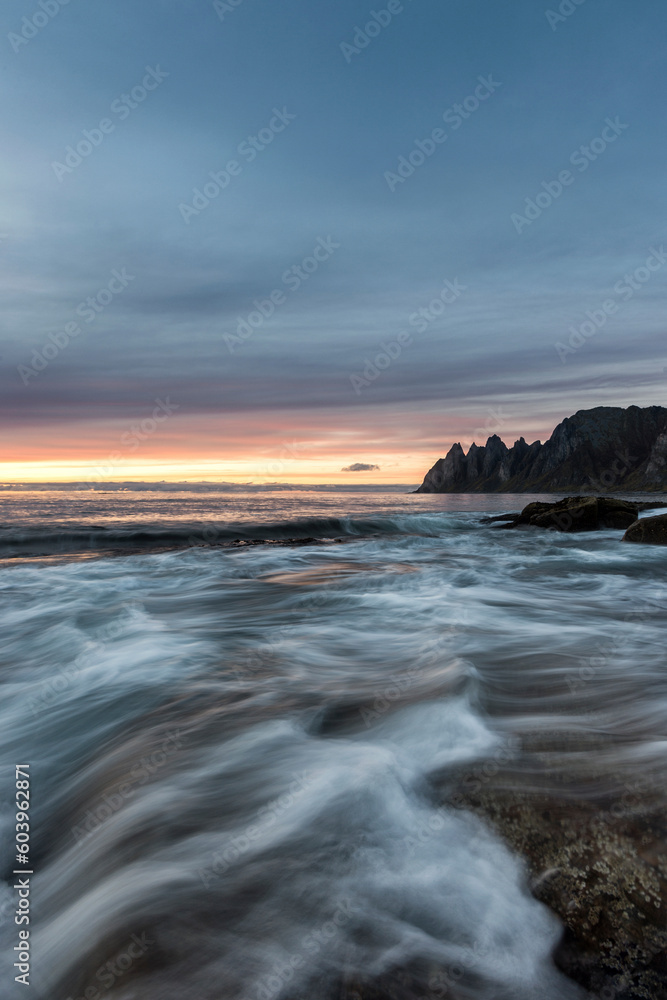 Long exposure of waves on beach under clouds Long exposure of waves on beach under clouds