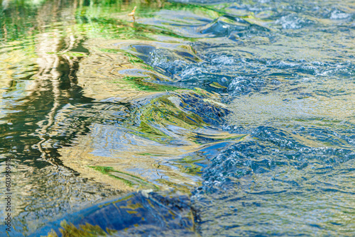 flow of water and spray from a stone