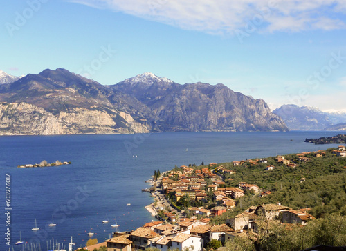 Panorama from the top of a small town on the shore of a sea bay and mountains in the far background