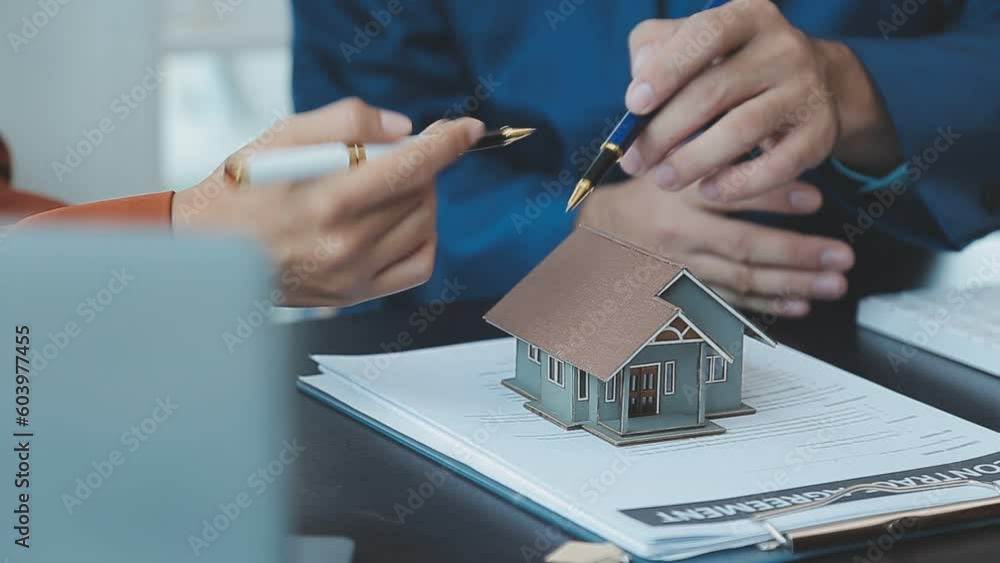 Signing home sales and insurance contracts with real estate agents