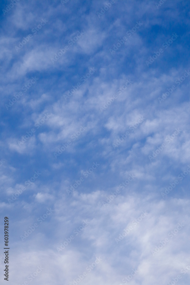 wallpaper, stretch ceiling or Beautiful white clouds on deep blue sky background. Elegant blue sky picture in daylight. Small thin soft white fluffy clouds in the blue sky background. No focus wallpaper, stretch ceiling or Beautiful white clouds on deep blue sky background. Elegant blue sky picture in daylight. Small thin soft white fluffy clouds in the blue sky background. No focus