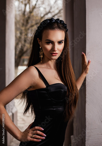 a woman in a Sicilian Italian look in a black dress